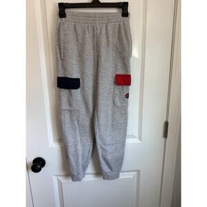 Champion fleece Boys Gray sweatpants size Medium. Blue and Red Pockets.